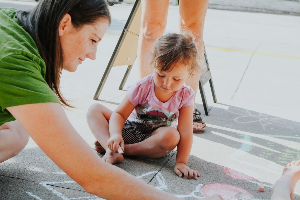 Chalk the Block artist, creating during an event by Teascarlet in Bonners Ferry, Idaho