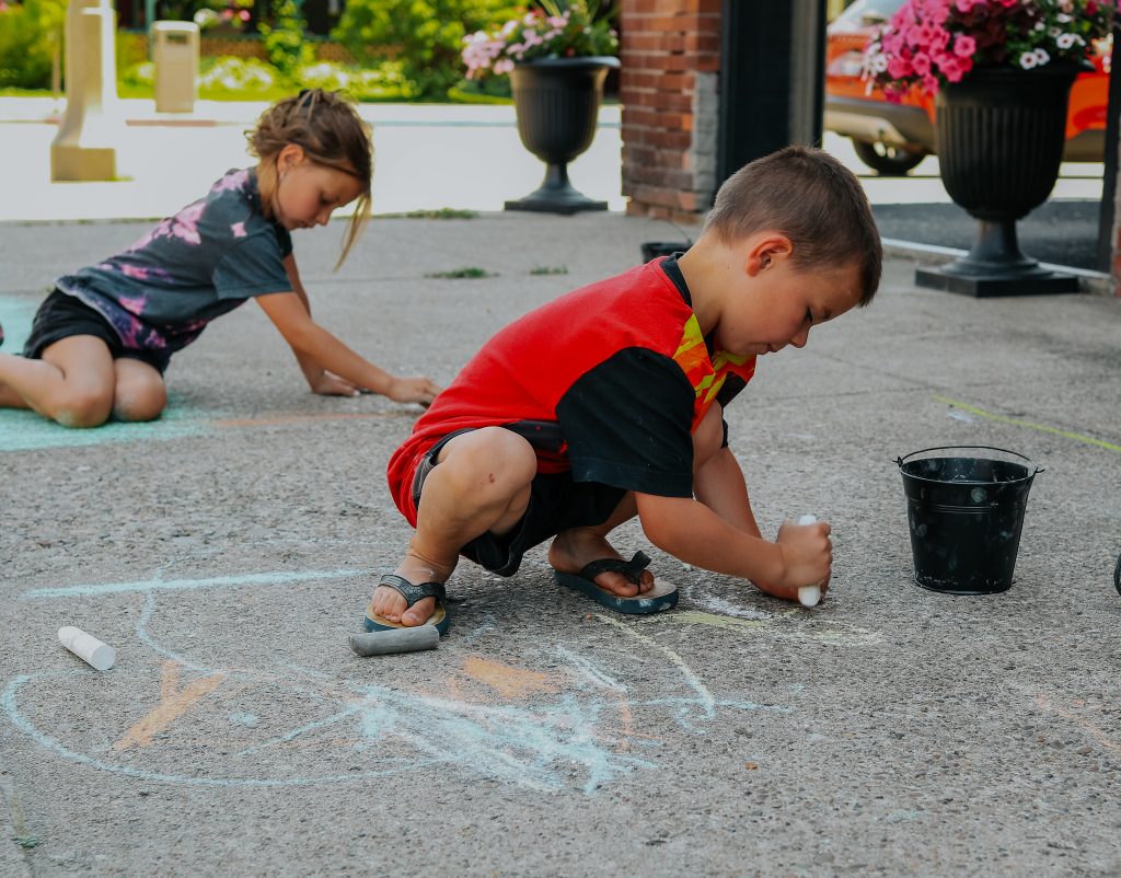 Chalk the Block artists, creating during an event by Teascarlet in Bonners Ferry, Idaho