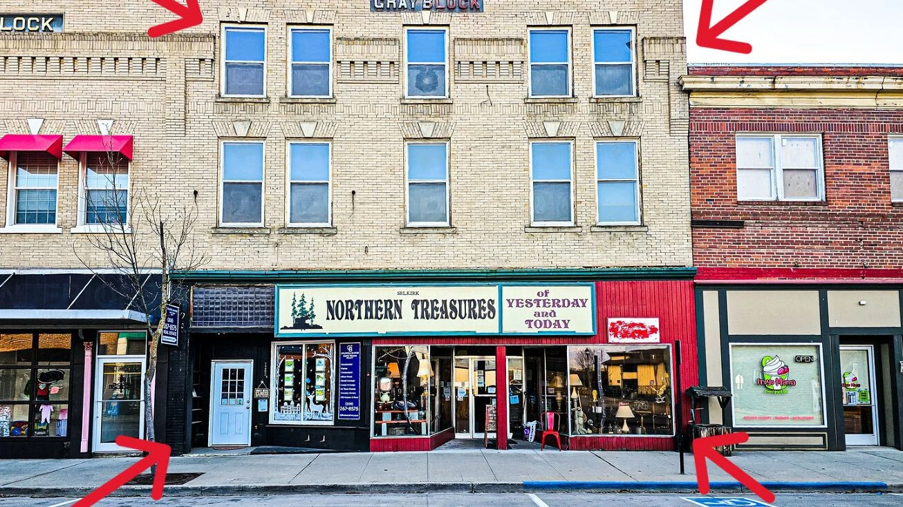 Gray building going on the auction block